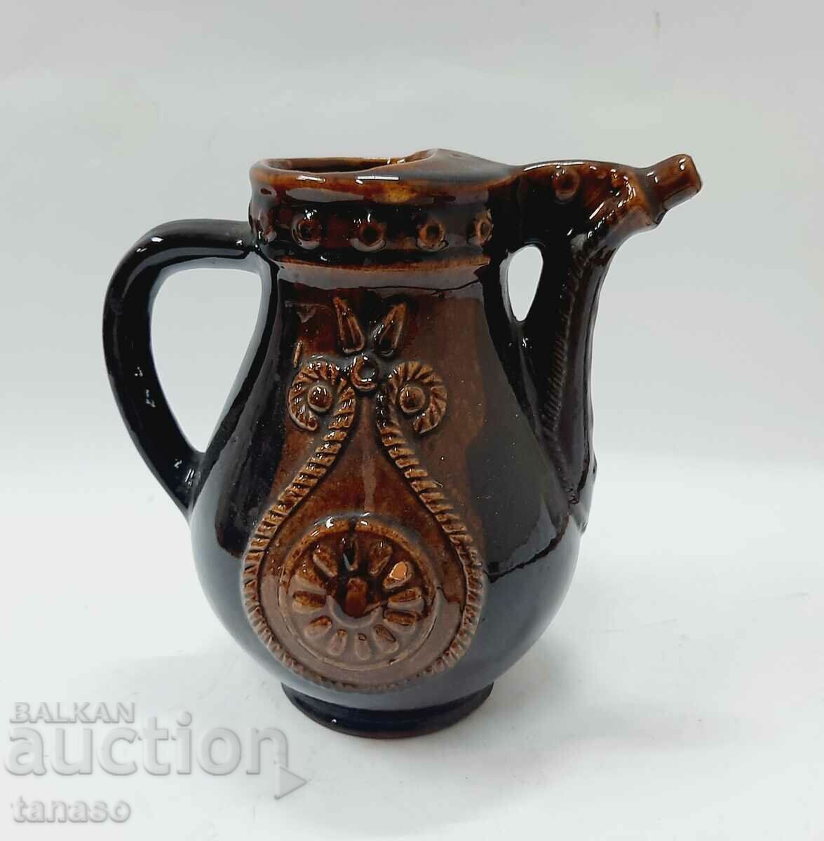 Auction  Old ceramic jug, decorated (13.5)
