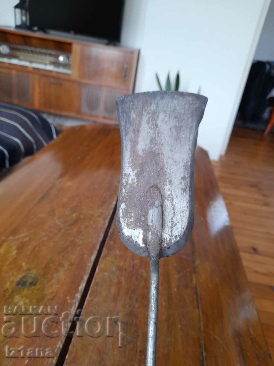 Delivery of Old shovel for fireplace, hearth