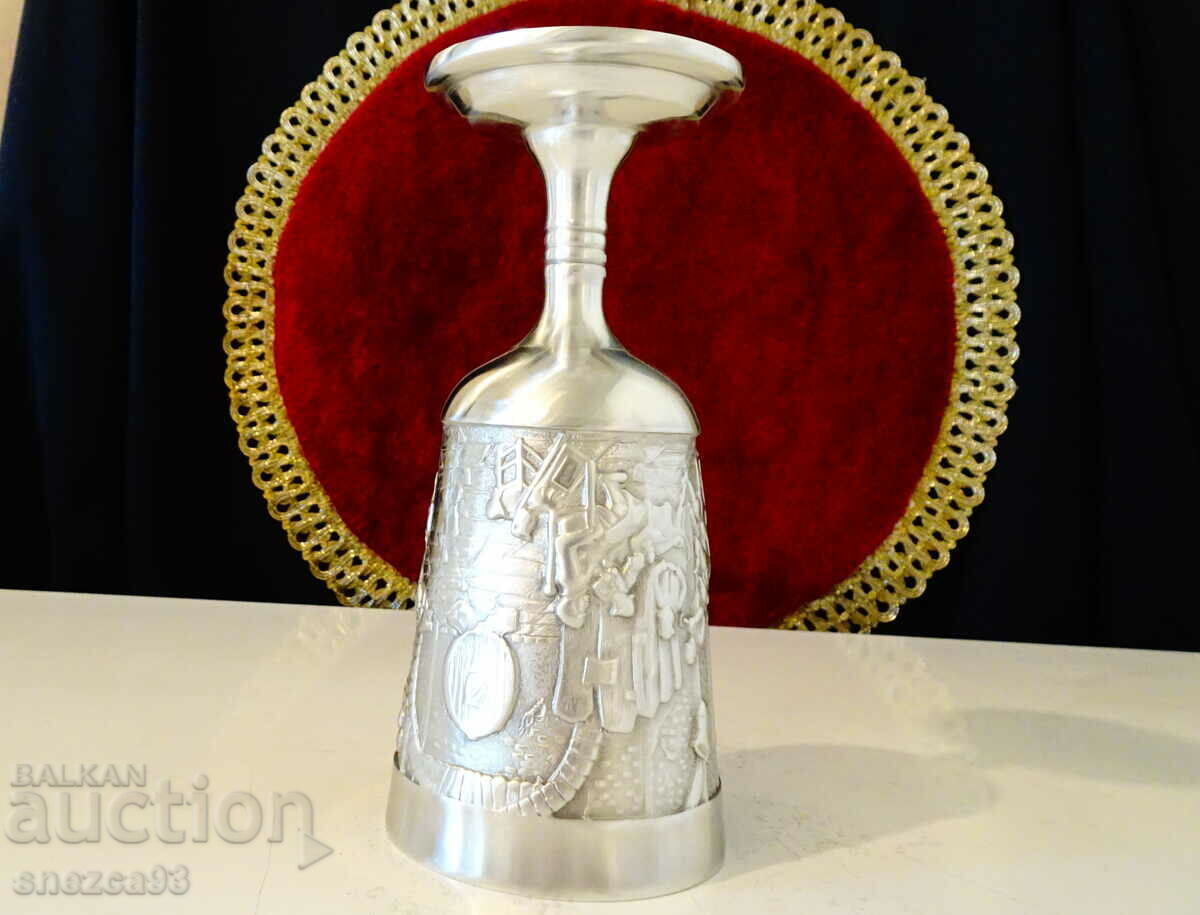 Auction Wine glass with embossed tavern scene Auction Wine glass with embossed tavern scene