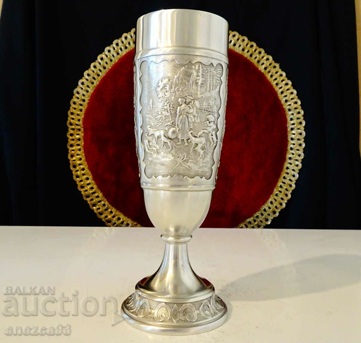 Auction Pewter goblet with idyllic pictures of country life. Auction Pewter goblet with idyllic pictures of country life.