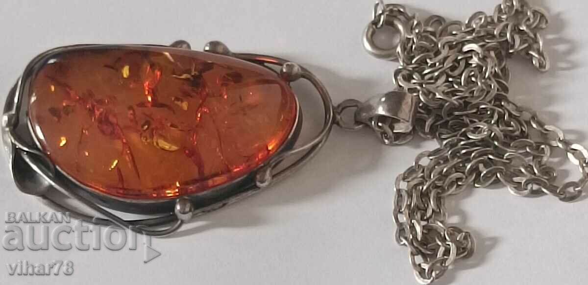 Auction Large silver pendant with amber Auction Large silver pendant with amber