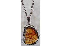 Large silver pendant with amber