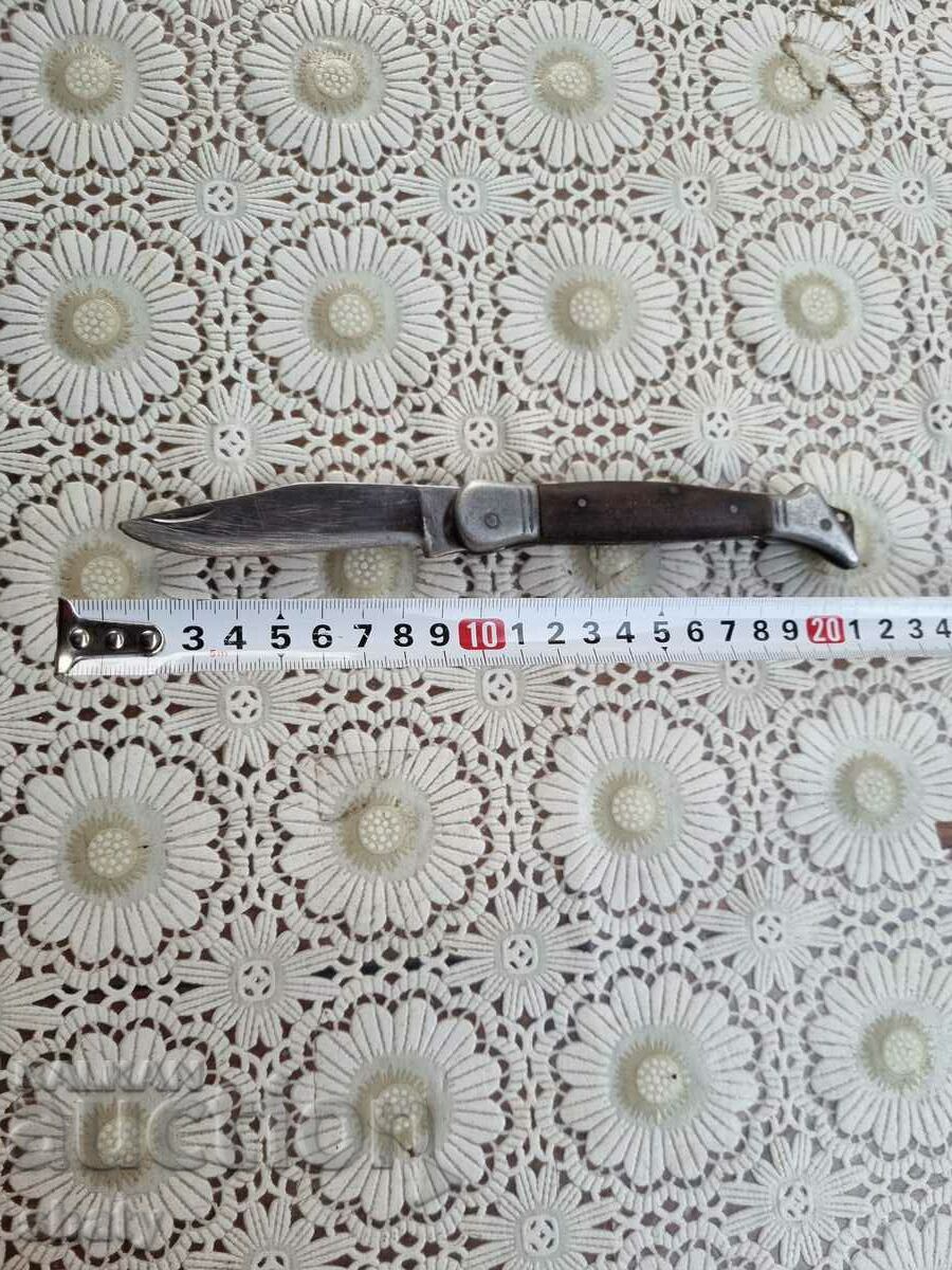 An old knife. BG Knife. A lady's leg.