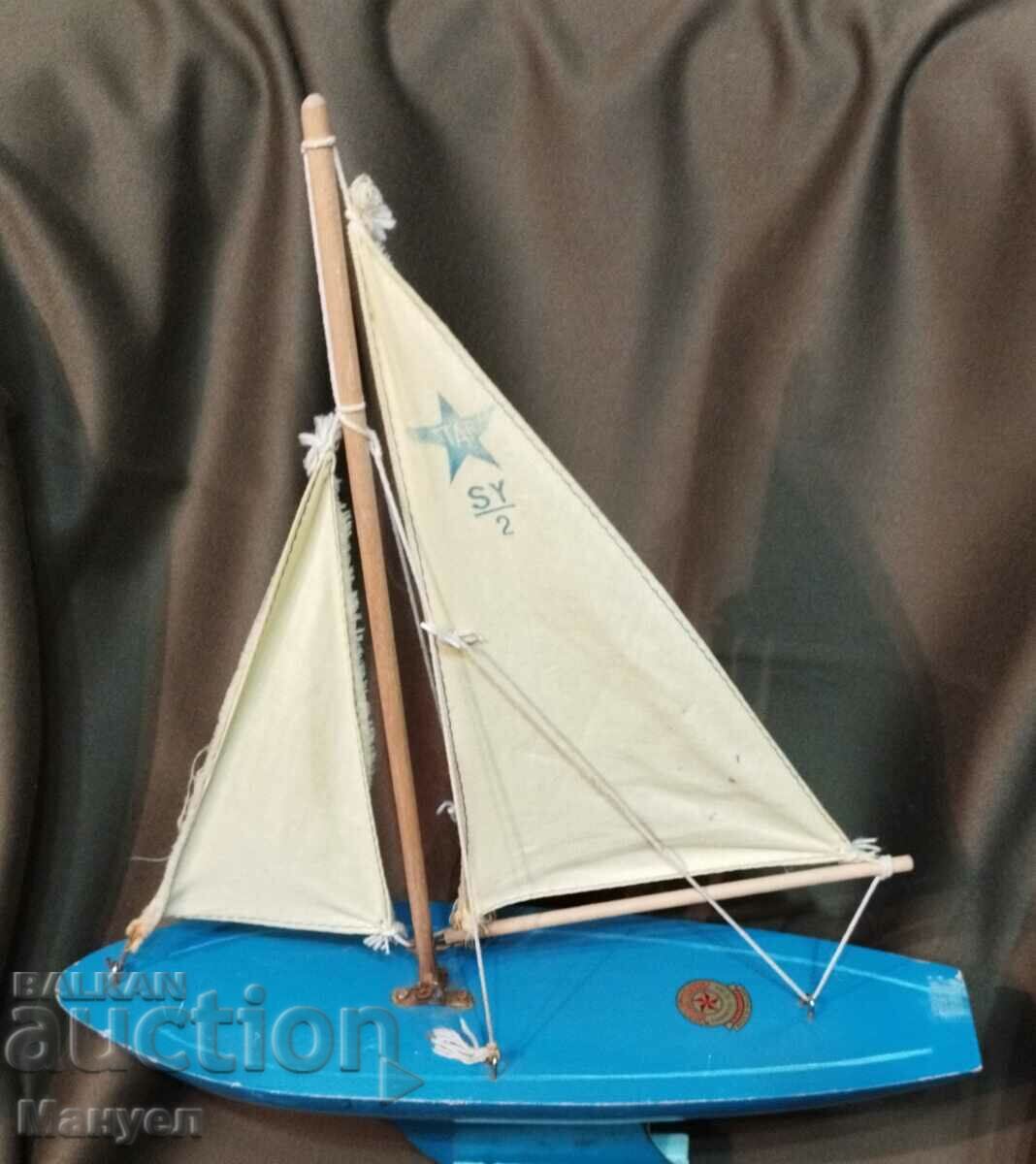 Old model of a yacht, a sailboat.