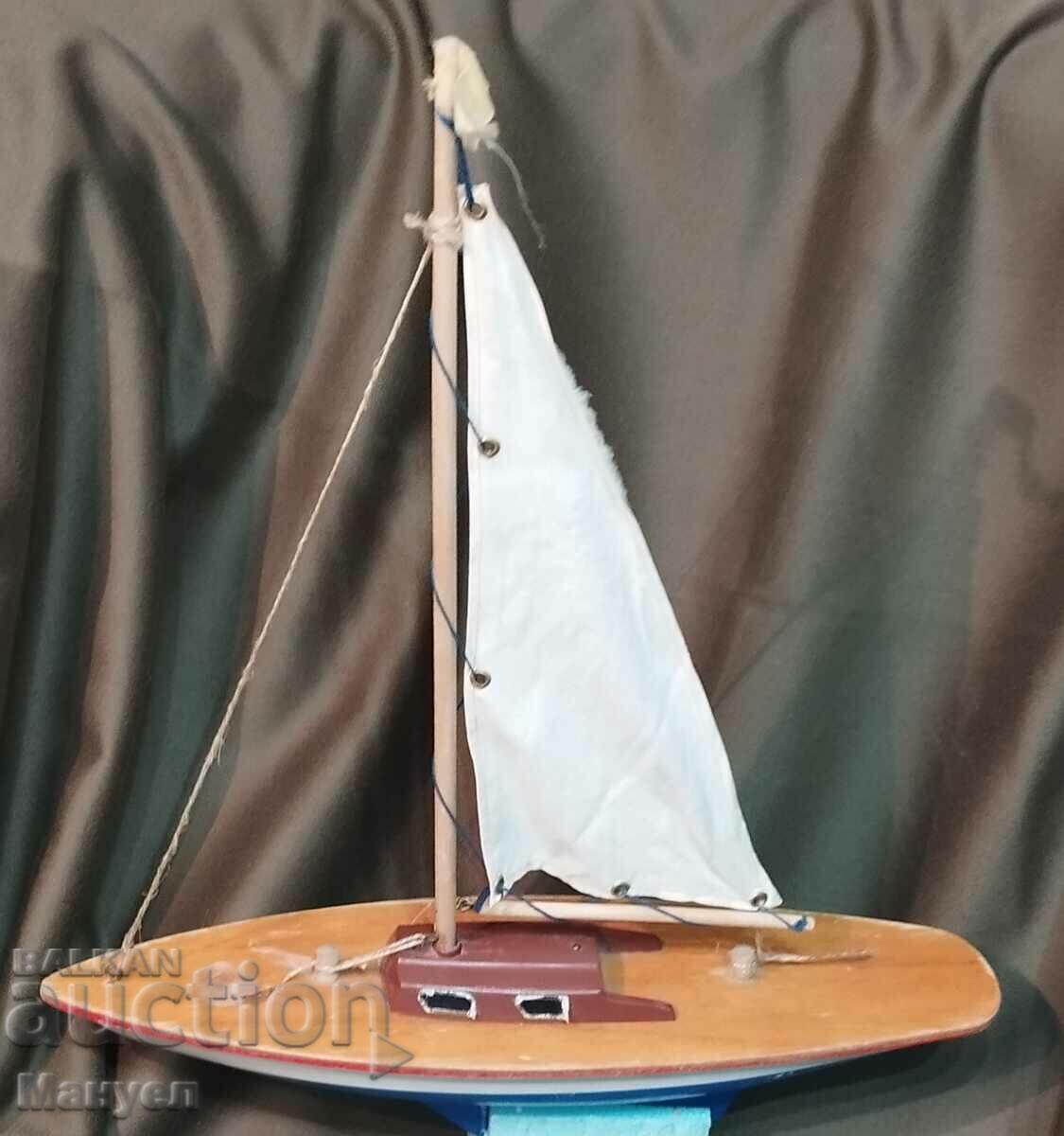 Delivery of Old model of a yacht, a sailboat. Delivery of Old model of a yacht, a sailboat.