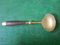 antique bronze serving spoon