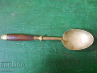 antique bronze serving spoon