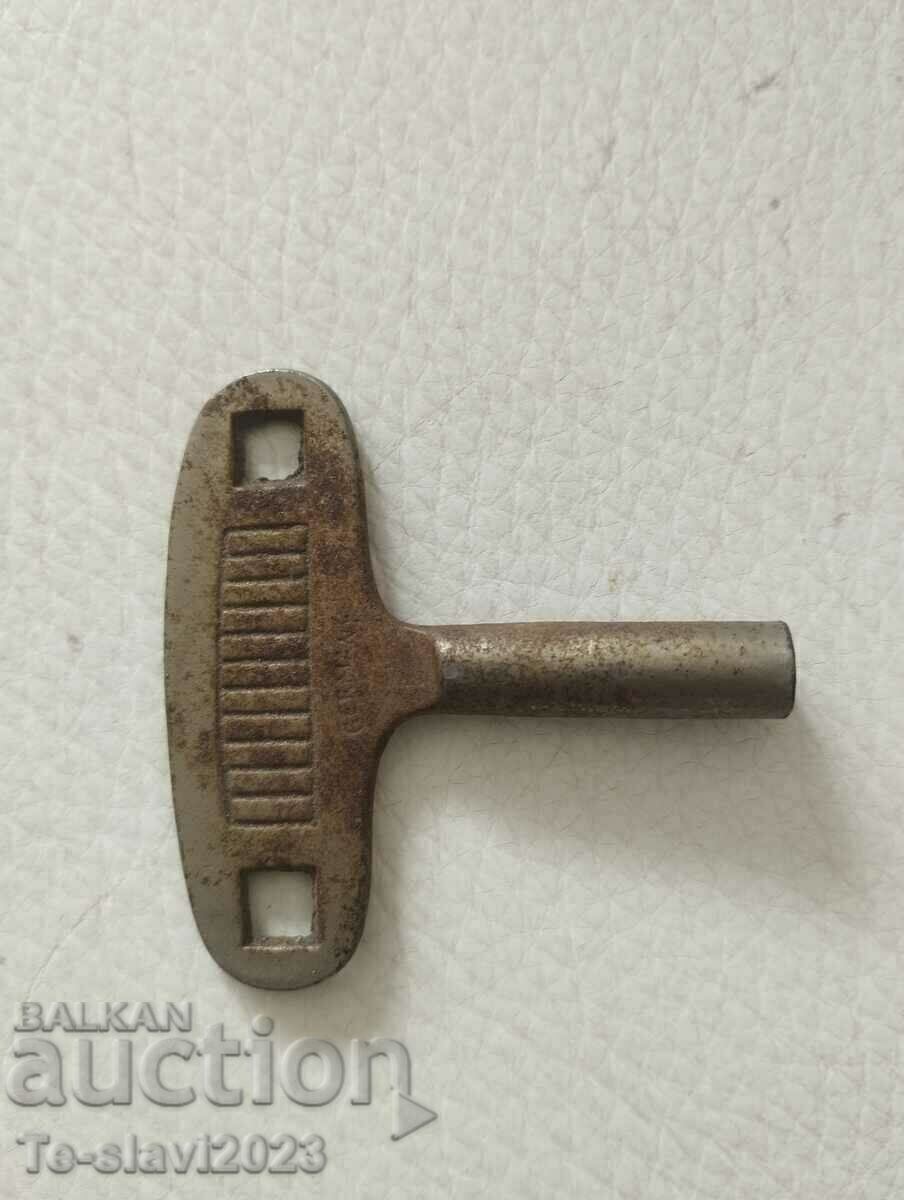 Old wall clock key