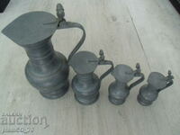 Nr.*7403 patru ulcioare metalice vechi - cu capace metalice