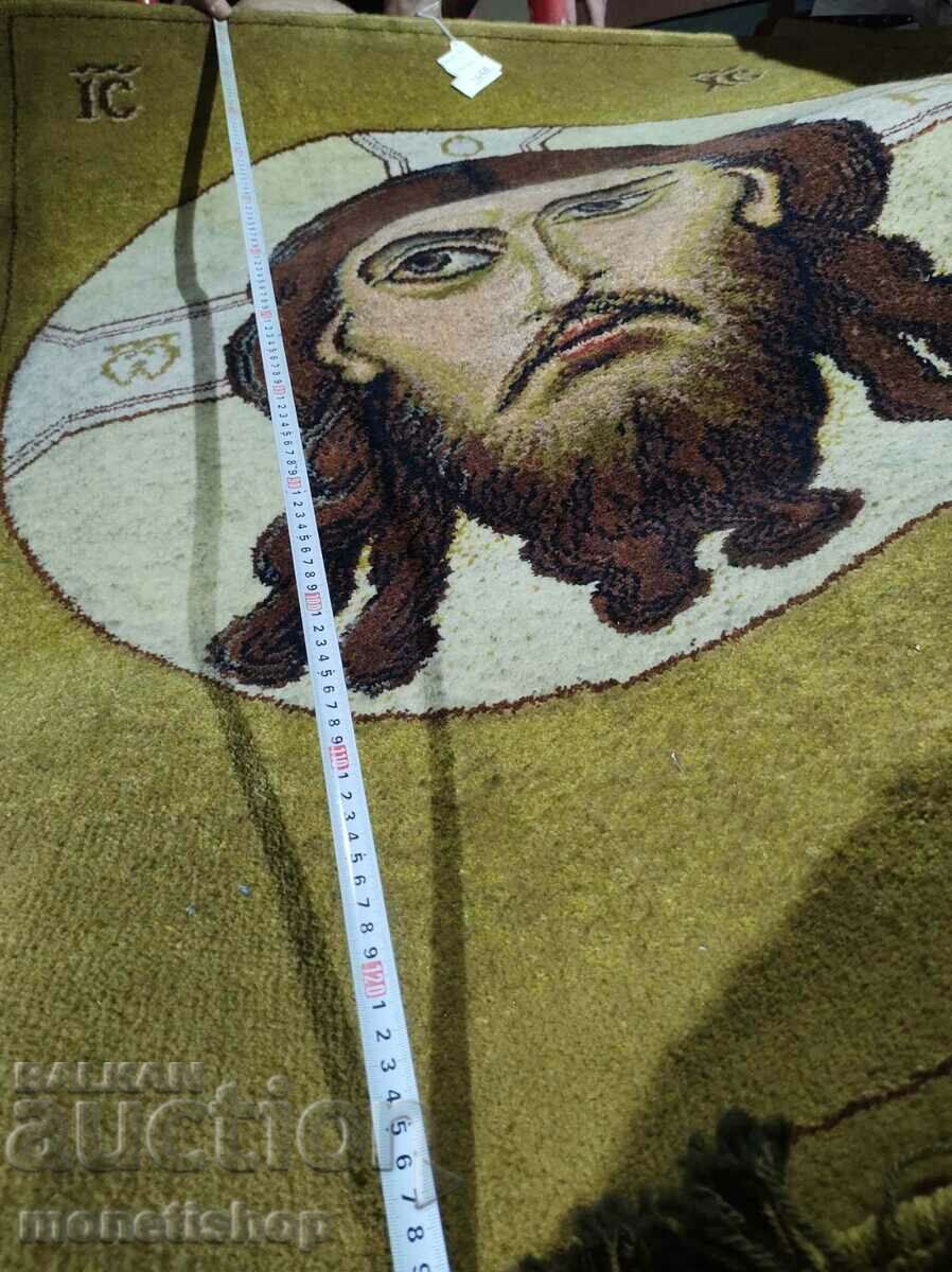 A huge woven tapestry with an image of Jesus Christ