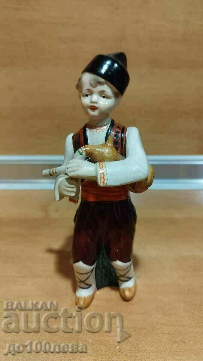 Old ceramic figure, bagpiper