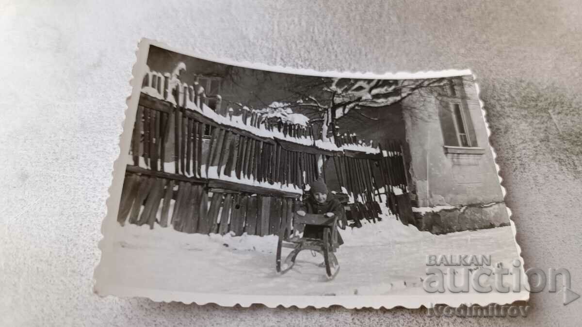 Photo Sofia Momchentse with a sled on the street in the winter of 1959