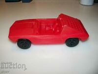 Red plastic car social toy