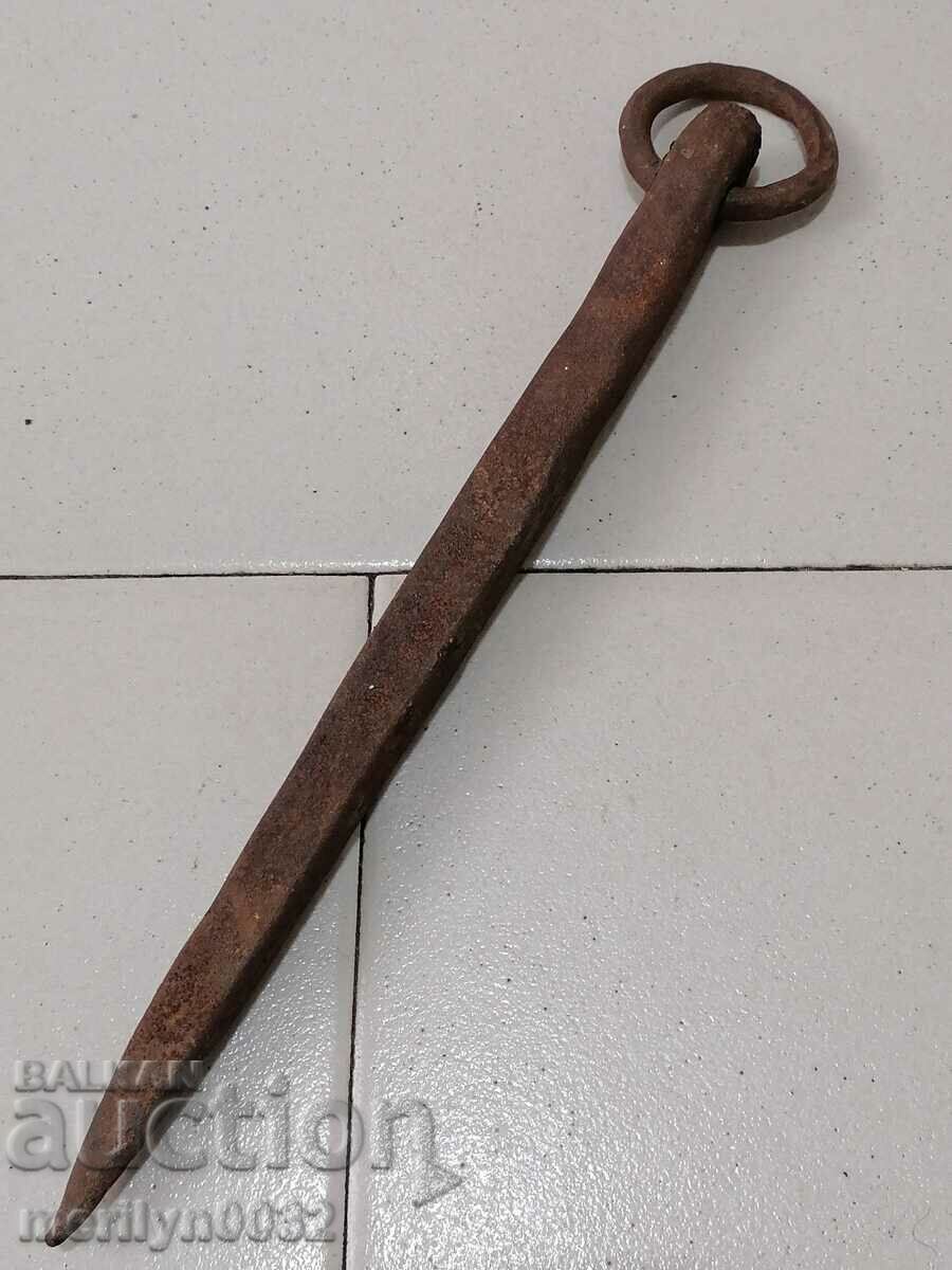 An old donkey's tack, a huge nail, wrought iron