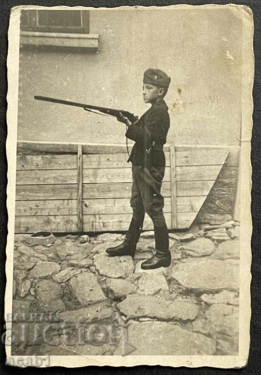 Auction Boy with rifle and Brannik belt knife Auction Boy with rifle and Brannik belt knife