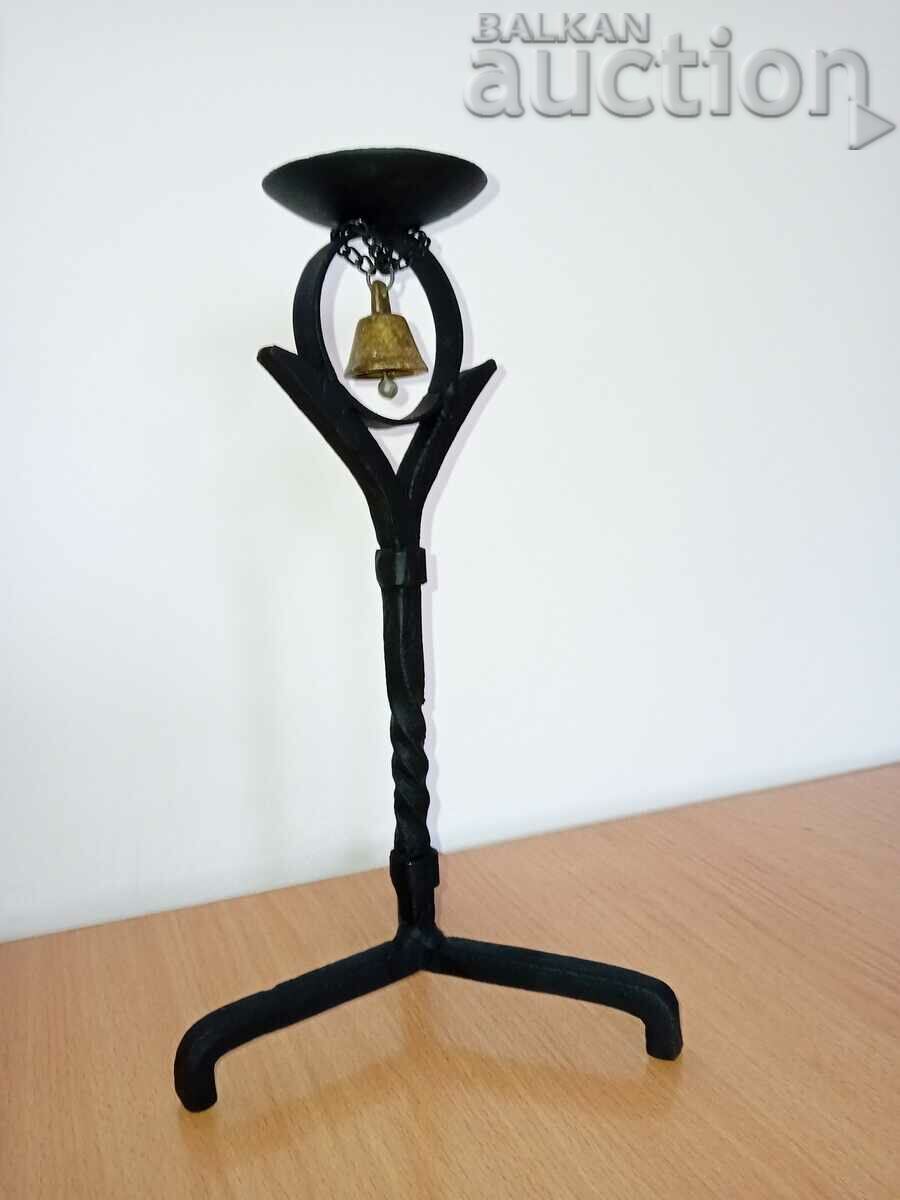 Delivery of Old forged candlestick with bell, candle, candelabra Delivery of Old forged candlestick with bell, candle, candelabra