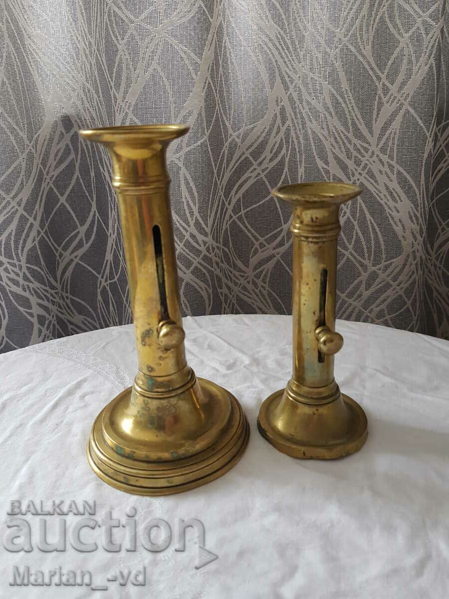 Two bronze candlesticks with lifter with price 70.00 BGN | € 35.79 Two bronze candlesticks with lifter with price 70.00 BGN | € 35.79