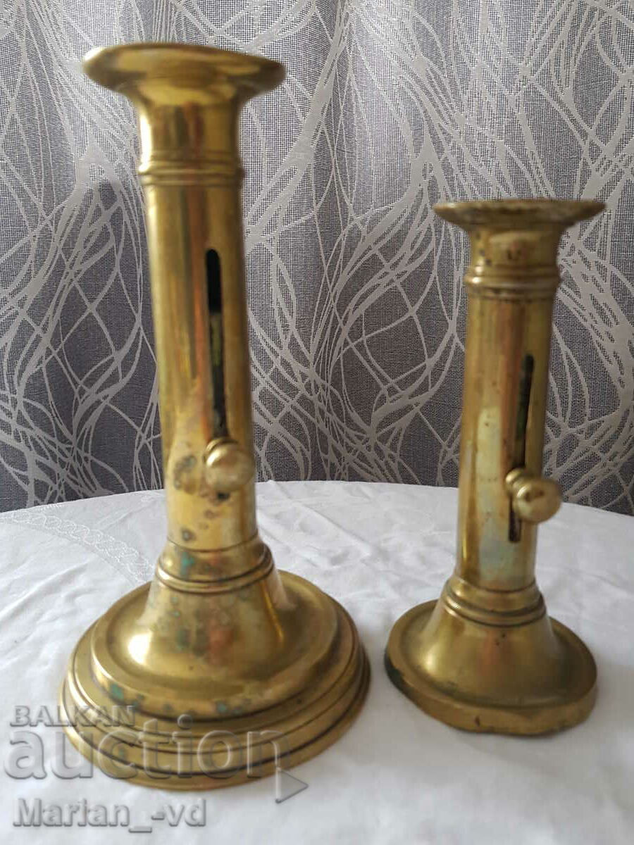 Delivery of Two bronze candlesticks with lifter Delivery of Two bronze candlesticks with lifter