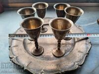 a set of brandy glasses with a tray NZC