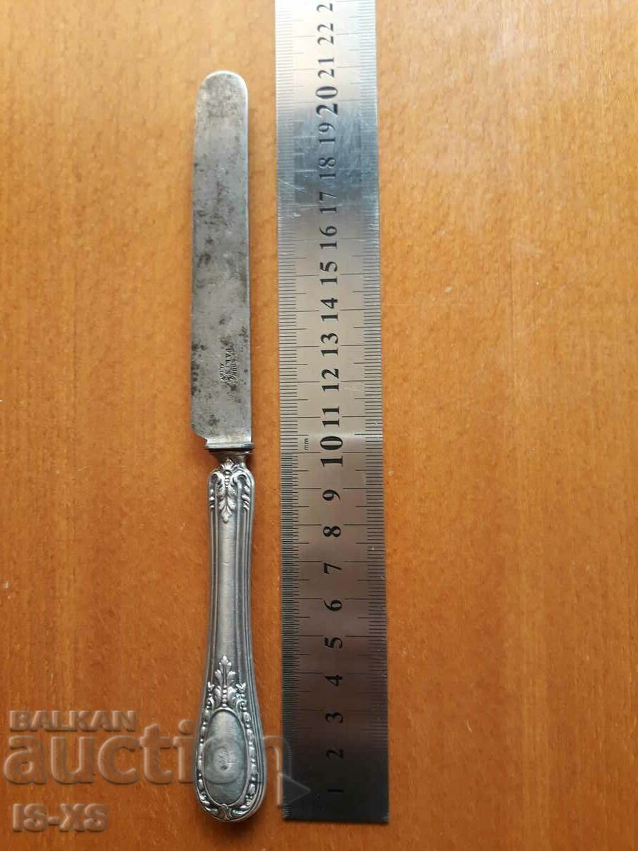 Silver knife with markings