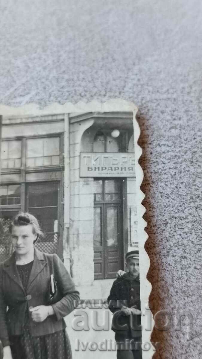 Photo Sofia Two women and a little girl in front of Tiger Beer Hall with price 2.65 BGN | € 1.35 Photo Sofia Two women and a little girl in front of Tiger Beer Hall with price 2.65 BGN | € 1.35