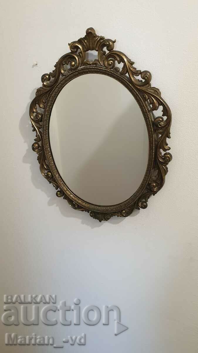 Old bronze wall mirror