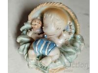 French vintage figurine of a sleeping baby in a basket HAND PAINTED.