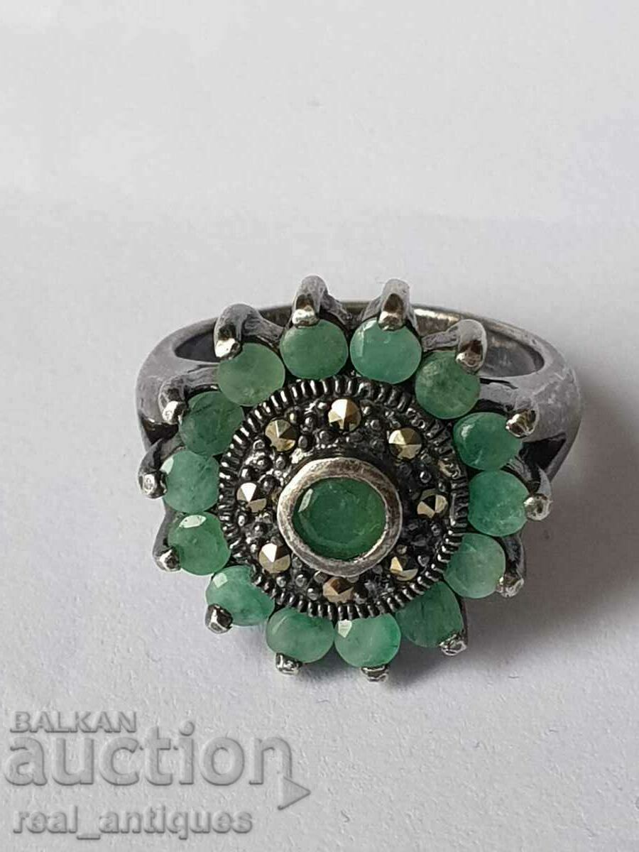 Silver ring with emeralds