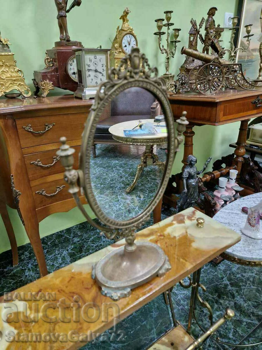 A wonderful antique bronze English mirror