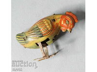 Old metal mechanical toy rooster figure