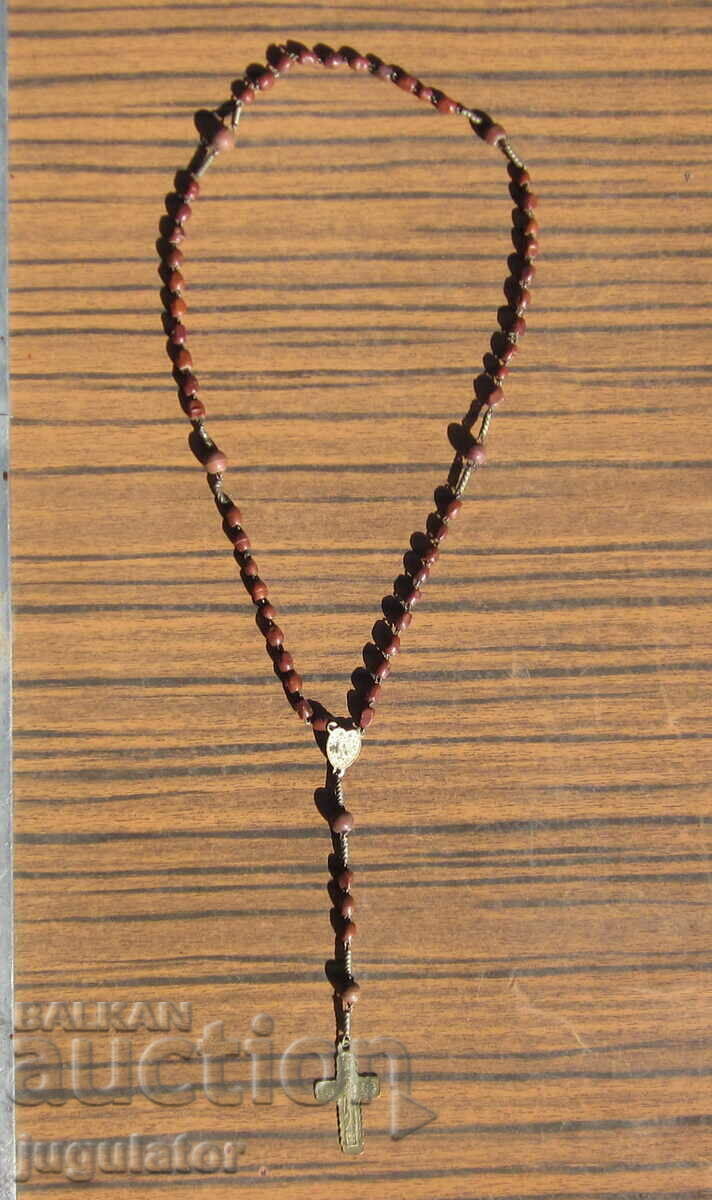 antique religious catholic rosary with cross and icon