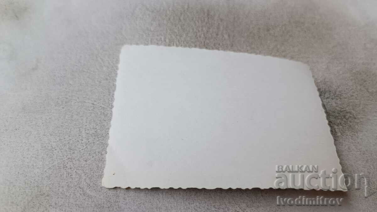 Photo Varna A woman and a little boy in front of Balkantourist with price 2.35 BGN | € 1.20 Photo Varna A woman and a little boy in front of Balkantourist with price 2.35 BGN | € 1.20