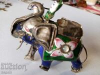 Silver elephant figurine with enamel.