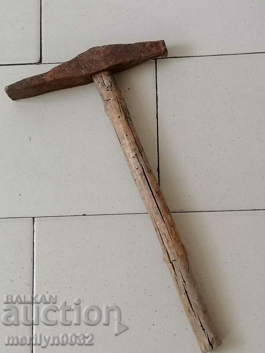 Old mason's hammer, tool, pickaxe