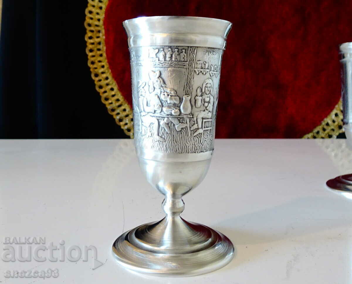 A glass on a chair for brandy, pewter. A glass on a chair for brandy, pewter.