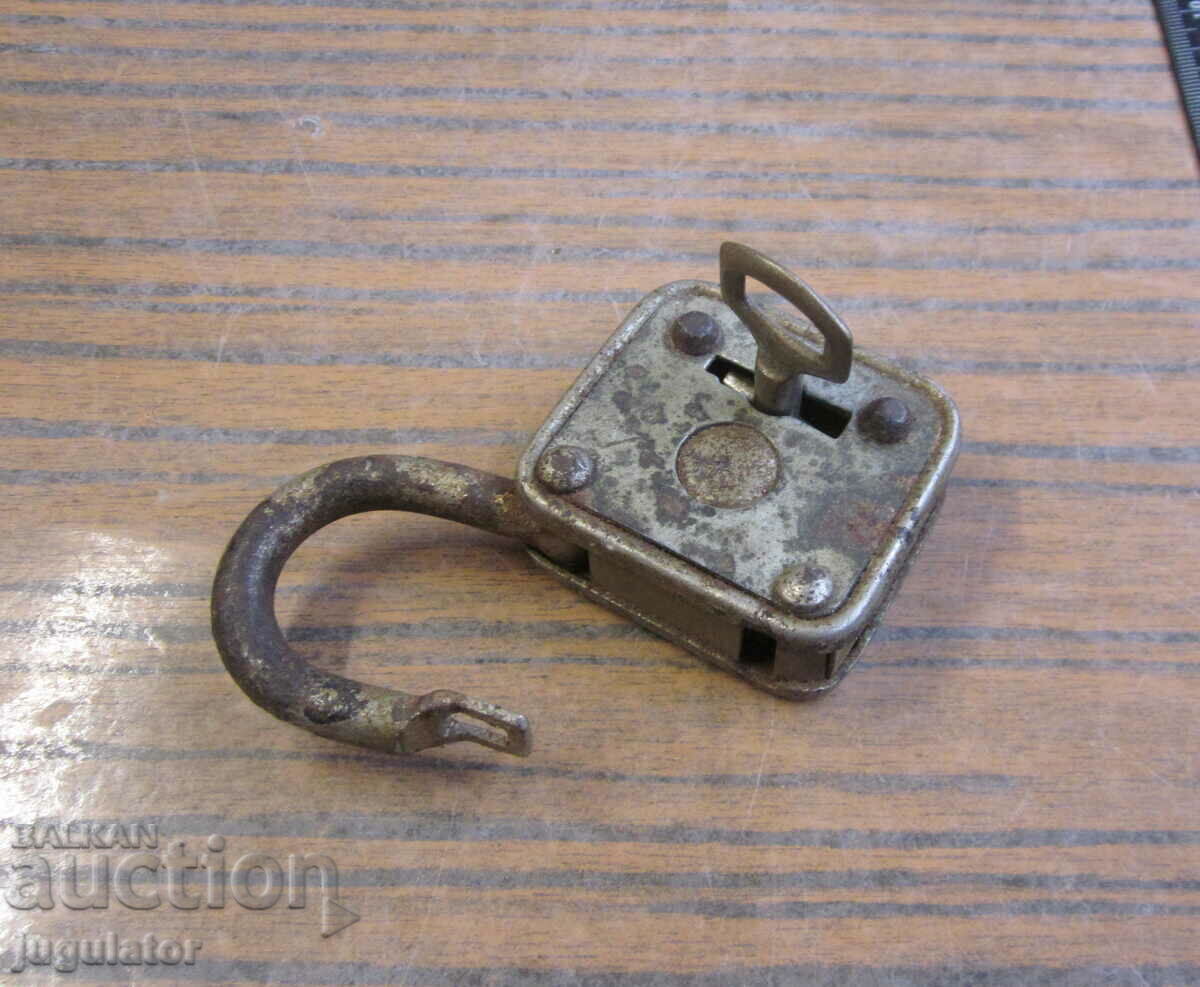 old vintage working padlock with key