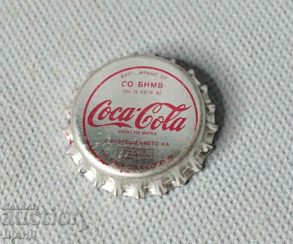 Coca Cola Un capac vechi dintr-o sticlă de Coca Cola fără alcool
