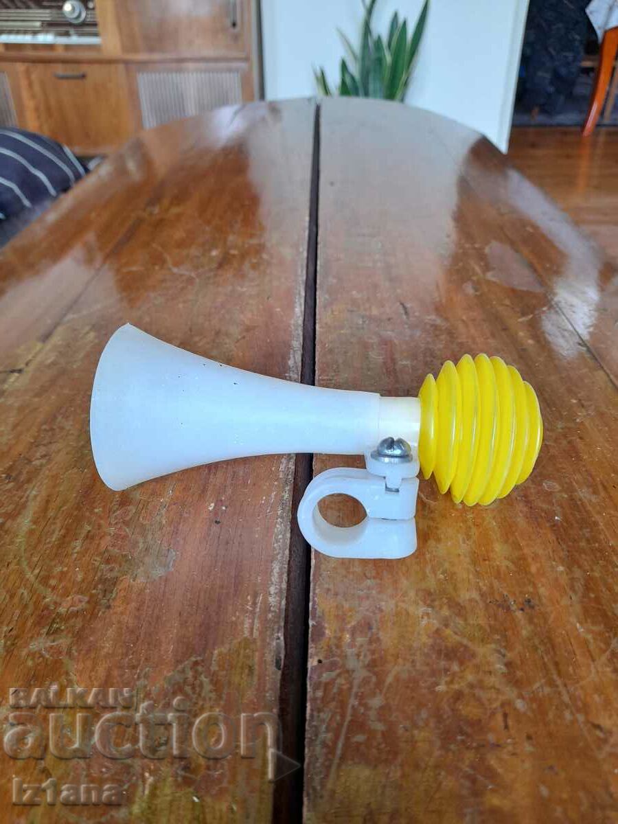 Old horn for children's bicycle, wheel