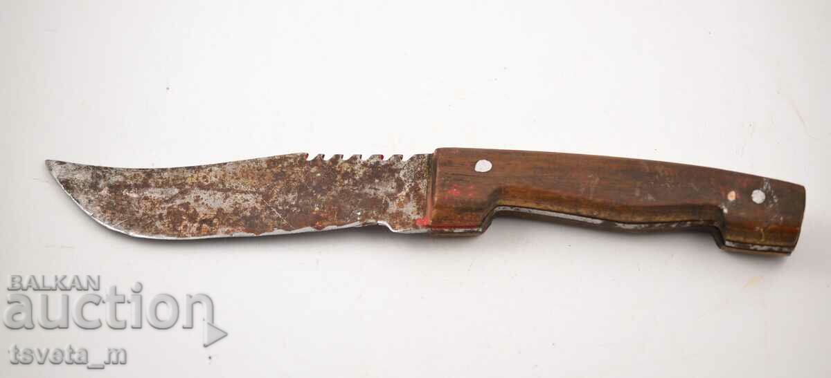 Antique knife with a wooden handle