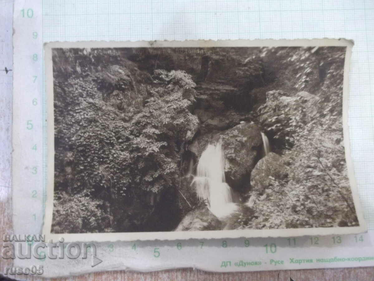 Old photo of a small waterfall