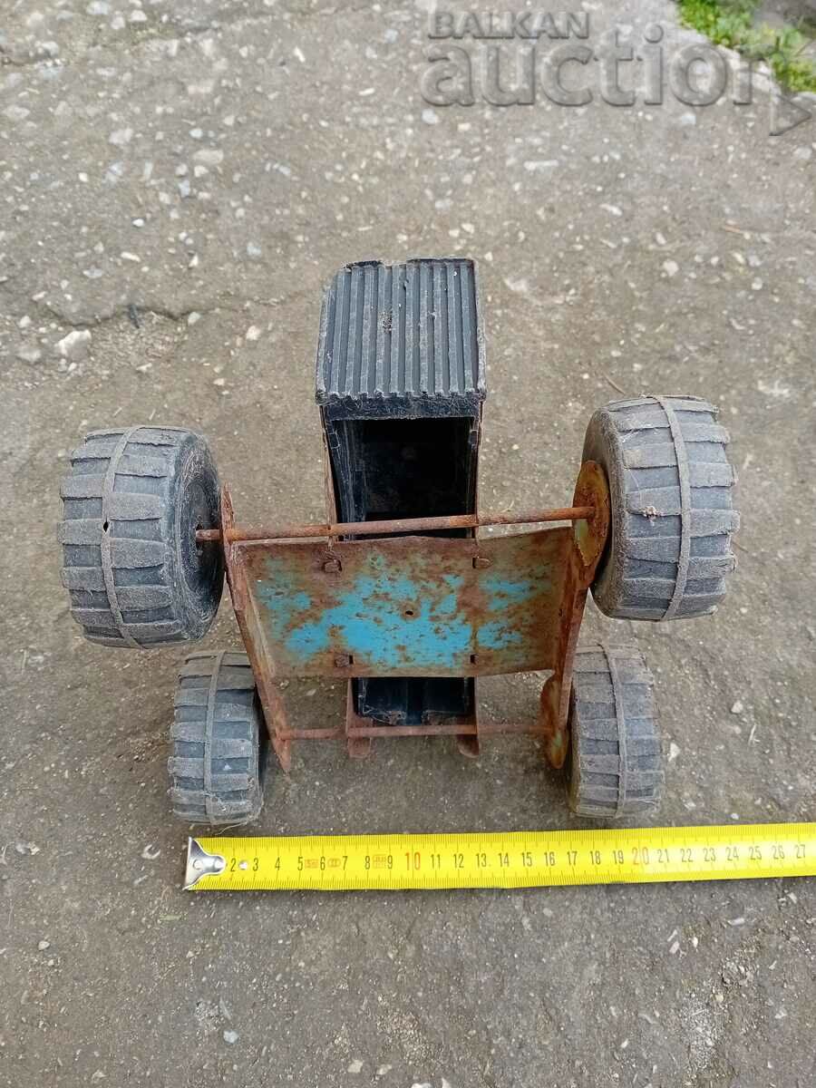 Delivery of tin toy 60s tractor