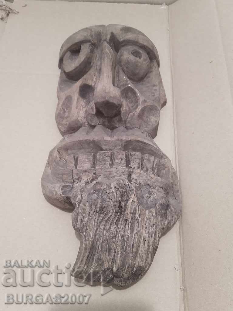 Old wooden figure, face, mask