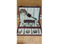 An old set of silver-plated, dessert utensils, in a box