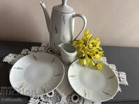 Set of teapot, milk jug and two plates