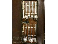 A set of spoons, forks, knives