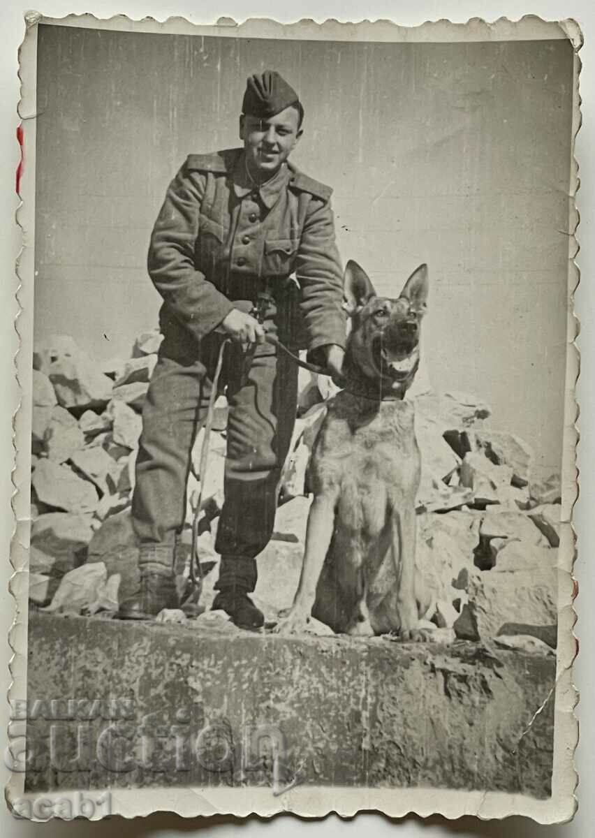 Border guard with his dog