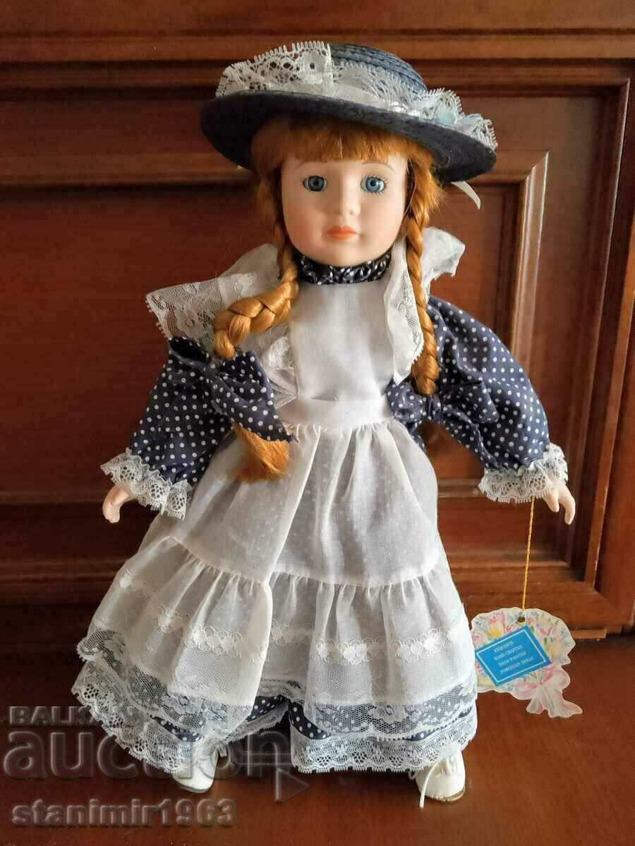 Collectible figurine, porcelain doll with stand and stamp