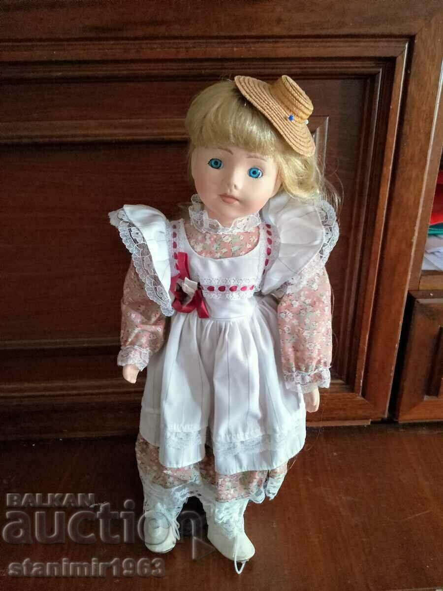 Collectible figurine, porcelain doll with stand and stamp