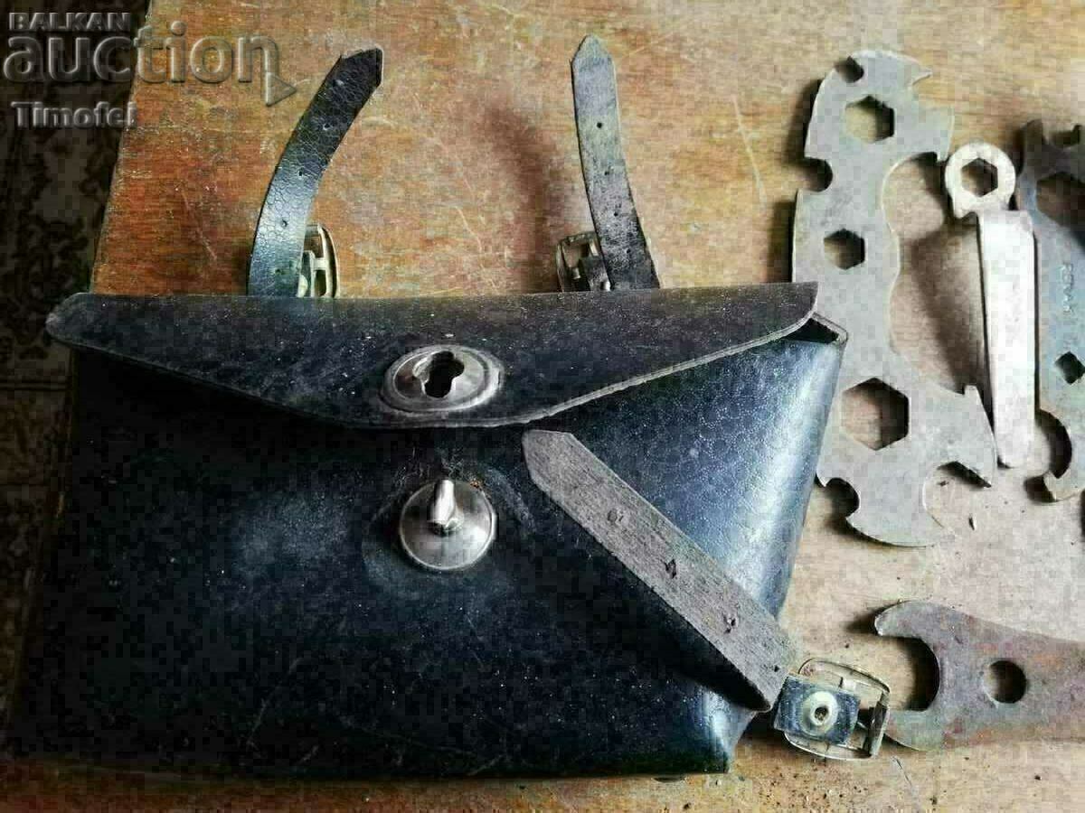 Old bag, bike tools, bike. Old bag, bike tools, bike.