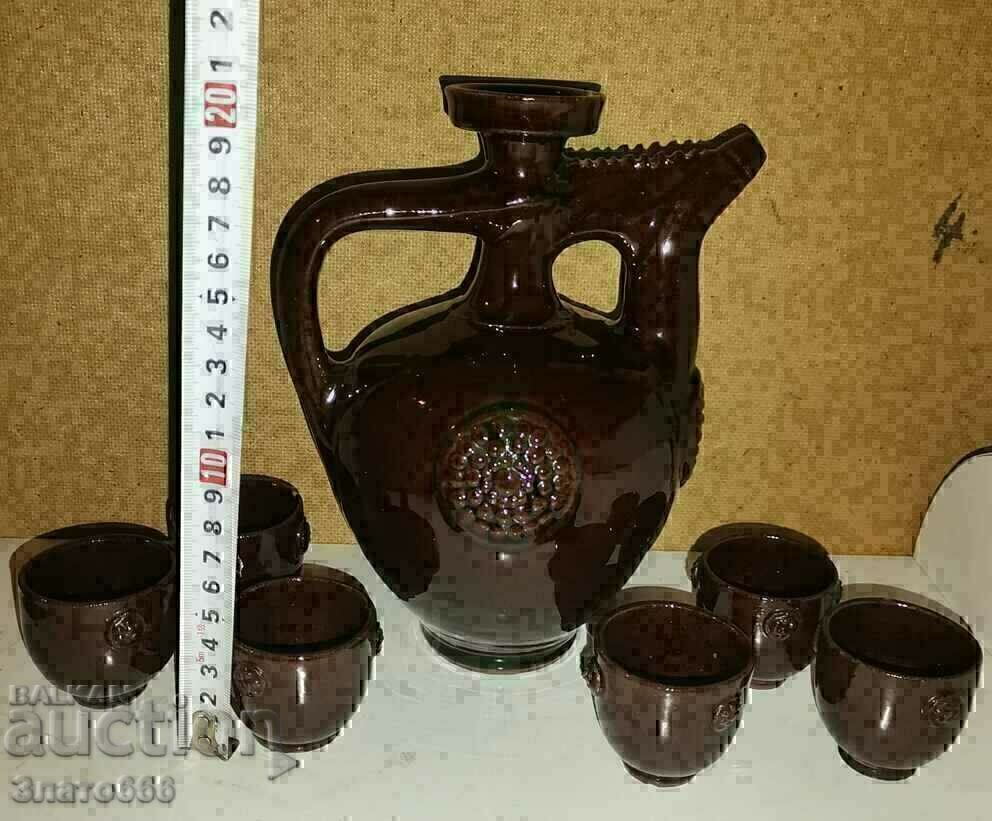 Auction Ceramic pitcher with cups Auction Ceramic pitcher with cups